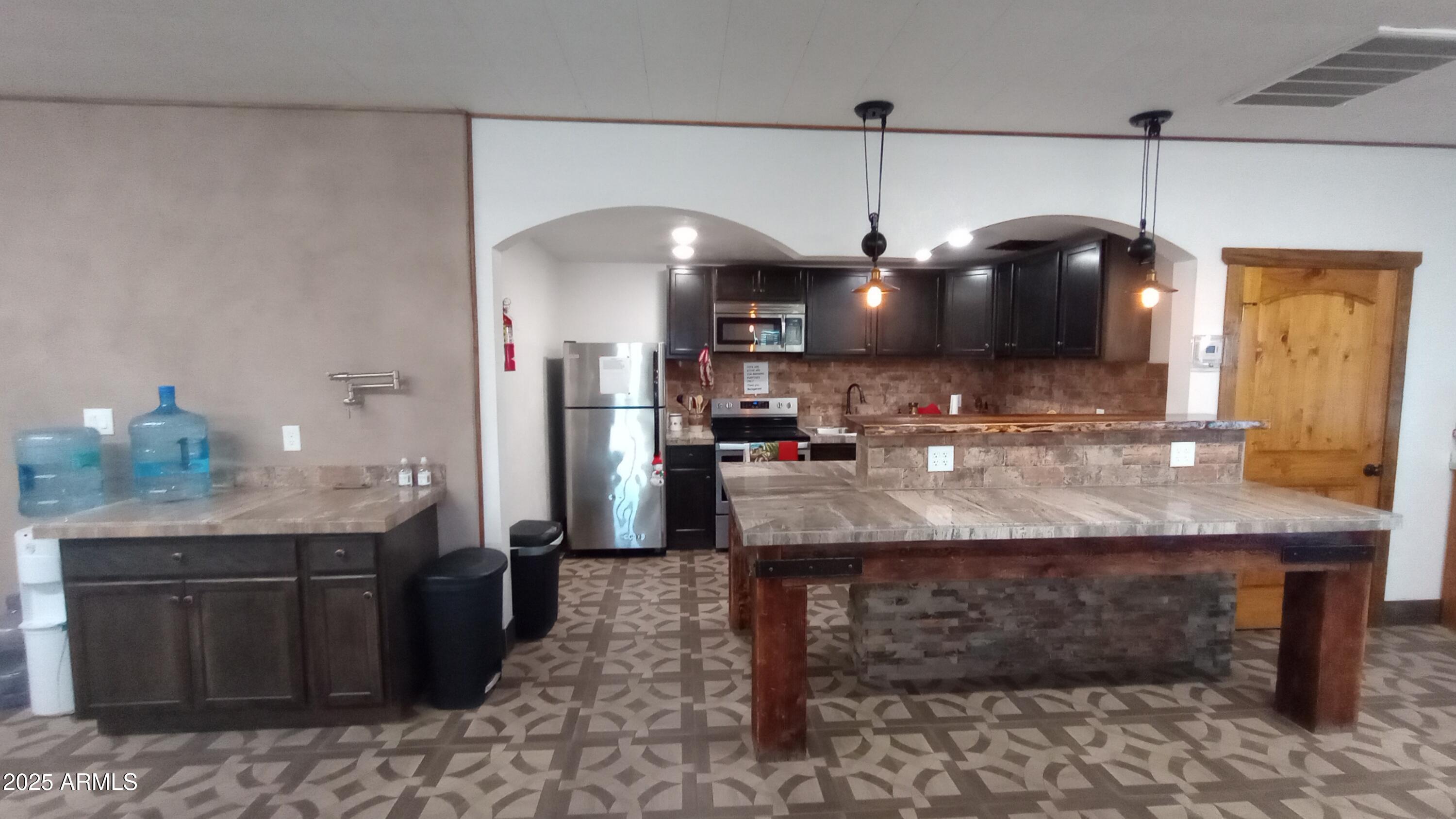 269 North Winchester Road, Unit 7 Apache Junction, AZ 85119 - Photo 20 of 26 a kitchen with a counter space a sink and appliances