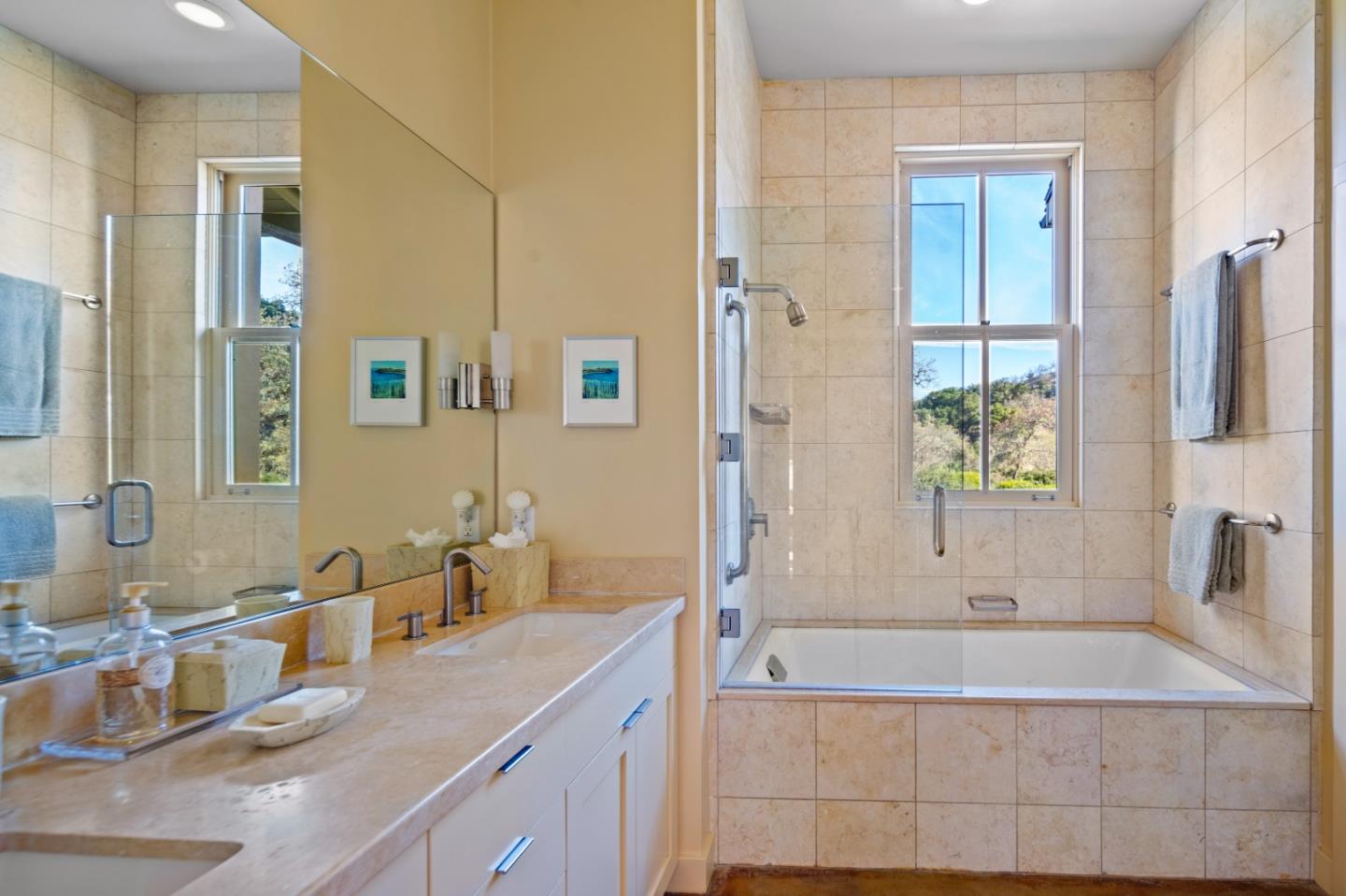 3 Refugio Trace Carmel, CA 93923 - Photo 22 of 29 a bathroom with a granite countertop tub sink and mirror