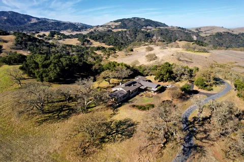 a view of mountains and house