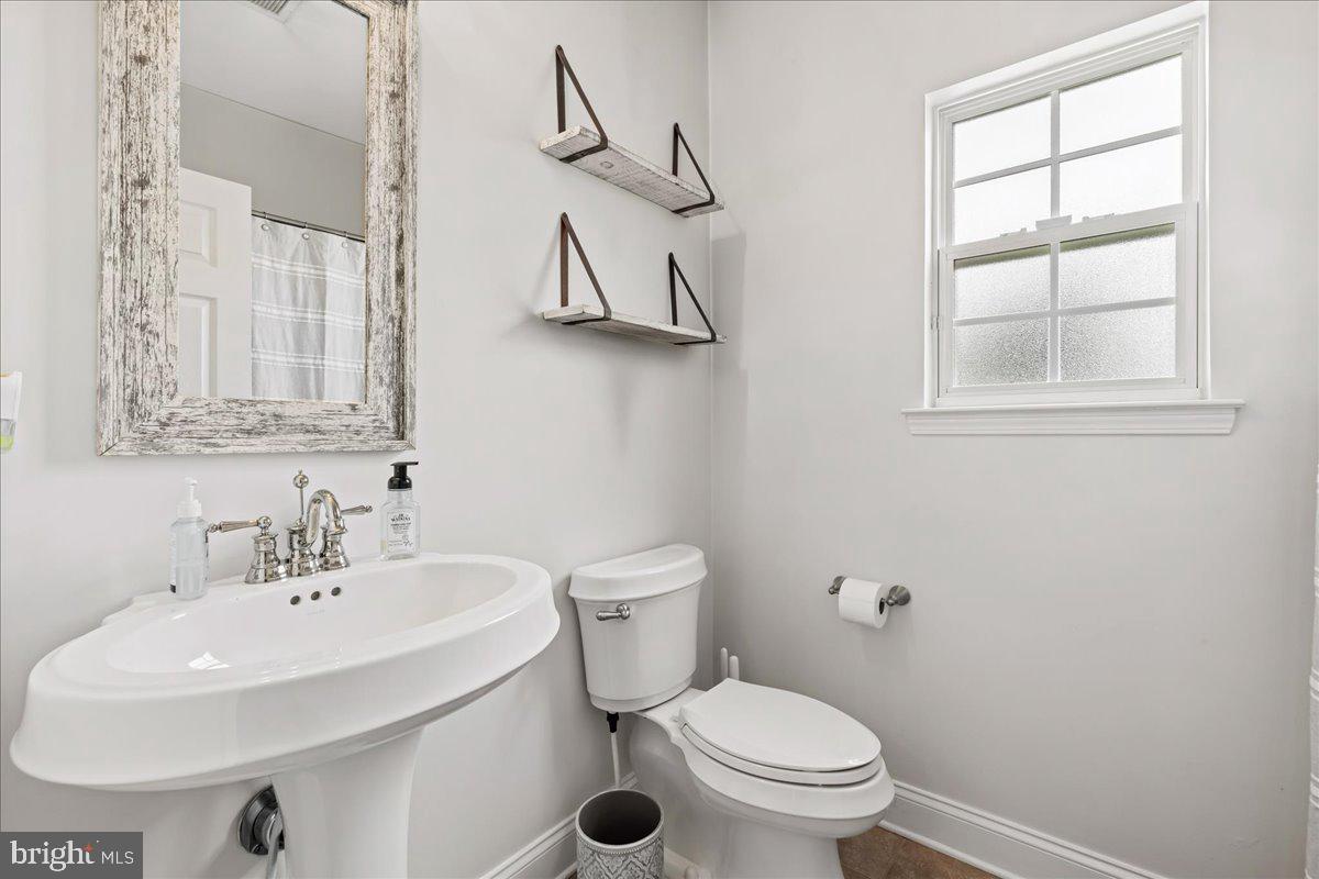 2650 Valhalla Road Vineland, NJ 08361 - Photo 35 of 49 a bathroom with a sink a toilet and a mirror