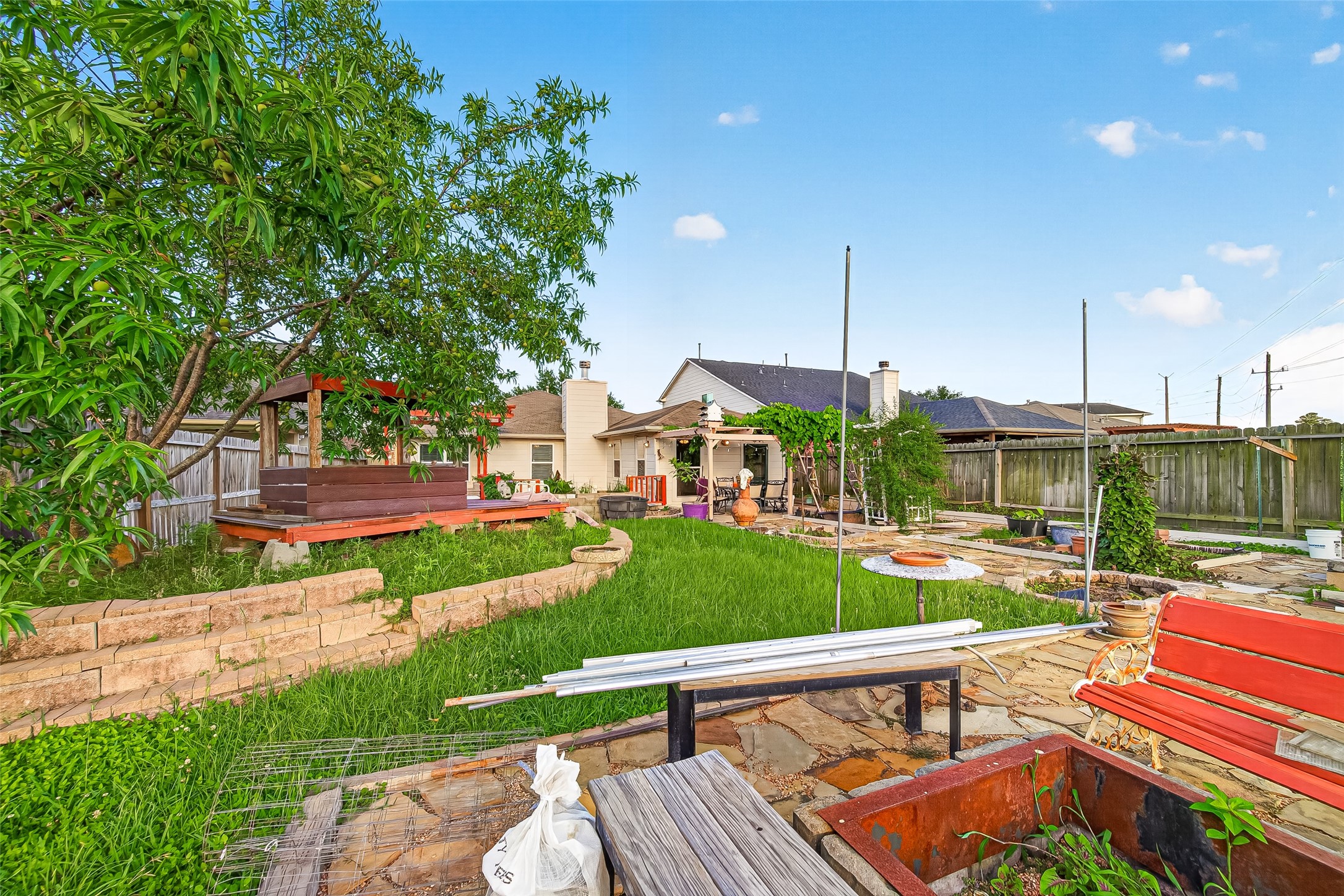 16715 Mackenzie Mesa Drive Spring, TX 77379 - Photo 45 of 50 a view of a chairs and table in backyard of the house