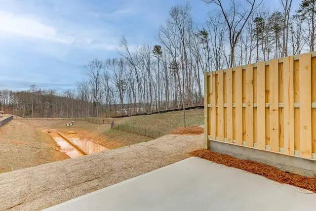 an aerial view of residential houses with yard