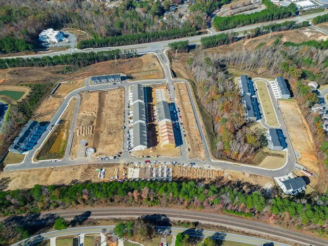 a aerial view of a house with a yard