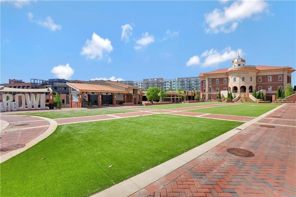 763 Woods Chapel Road Sugar Hill, GA 30518 - Photo 60 of 67 a front view of a house with a yard