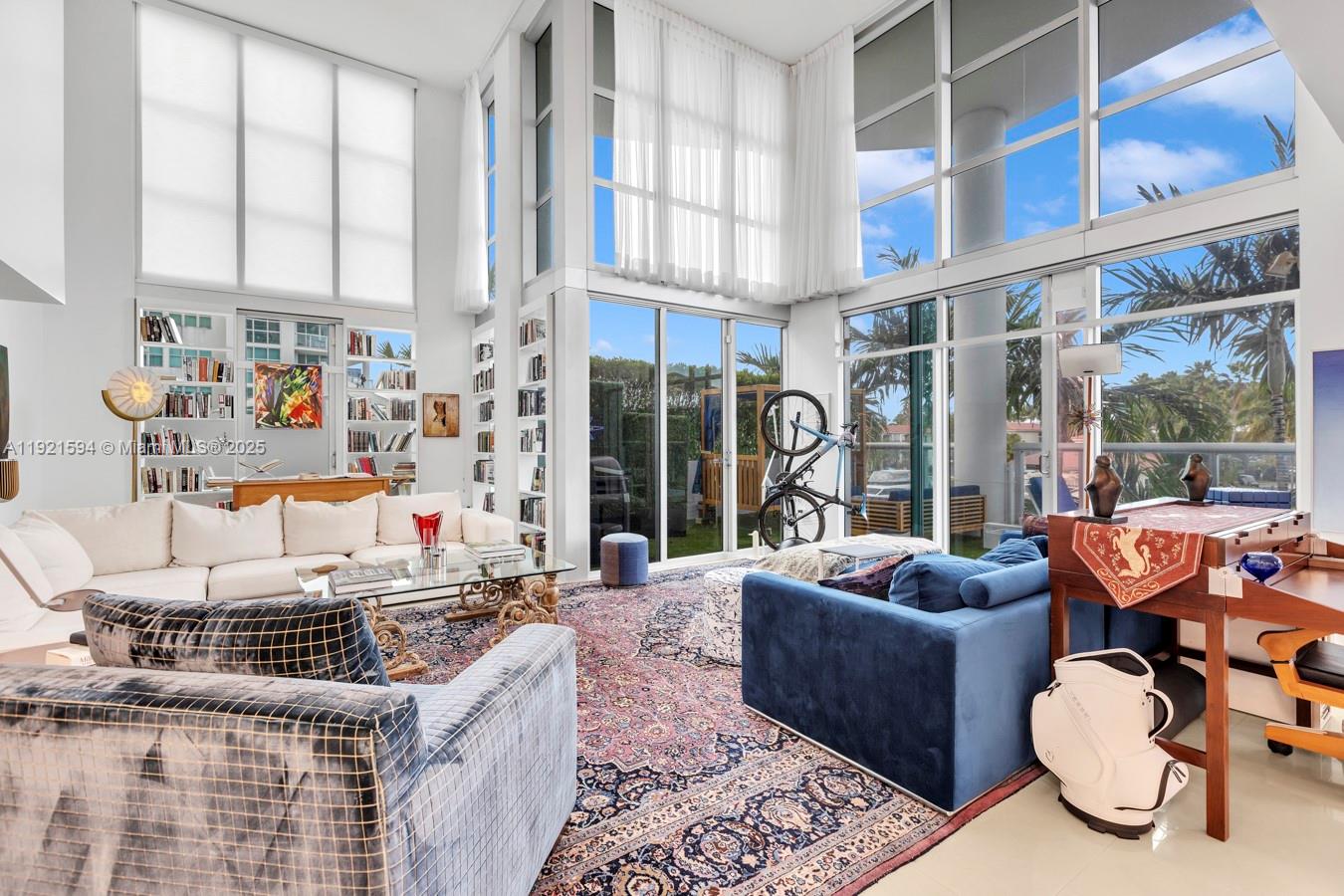 3131 Northeast 188th Street, Unit 2301 Aventura, FL 33180 - Photo 2 of 73 a large living room with furniture and a large window