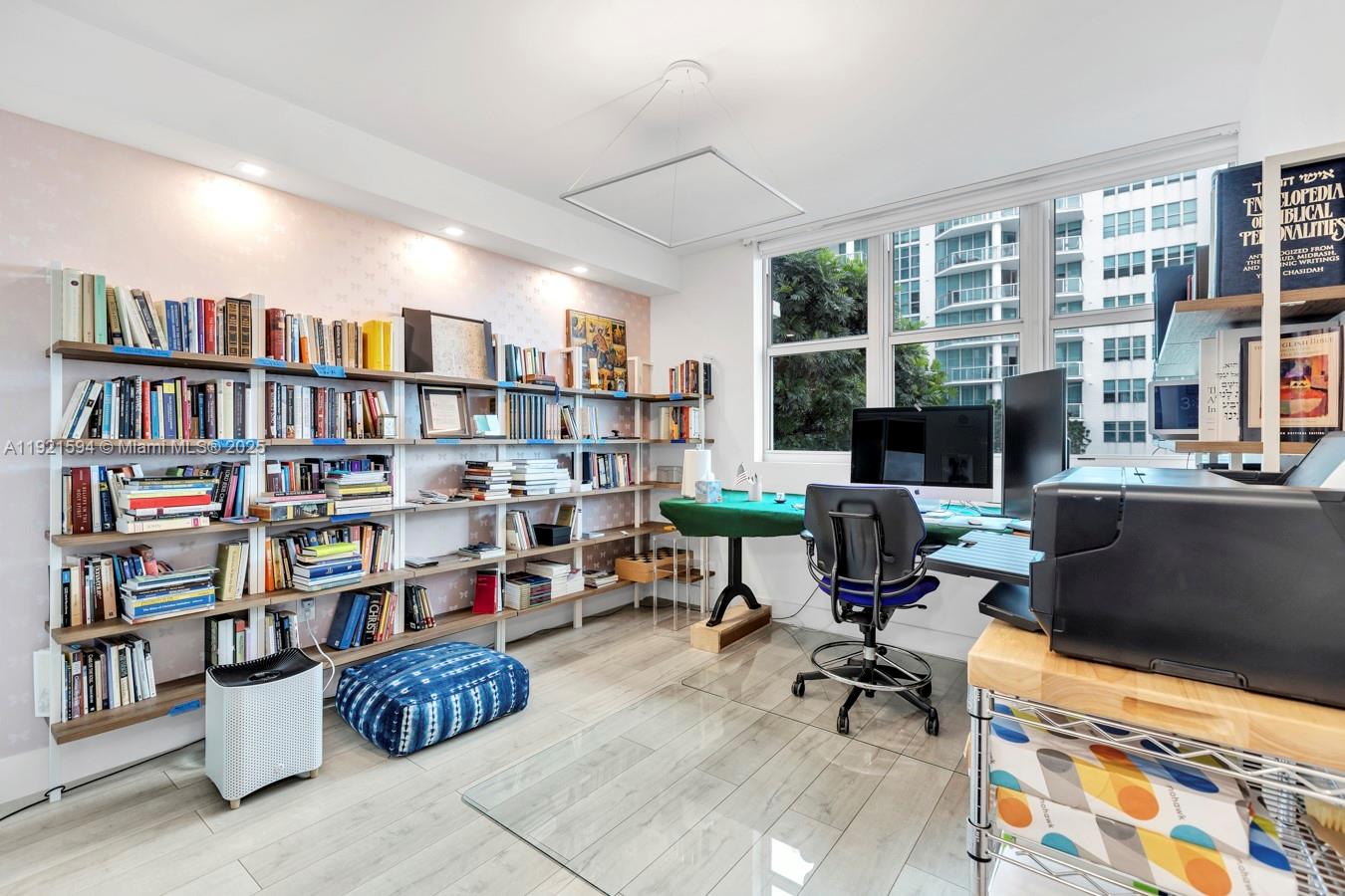 3131 Northeast 188th Street, Unit 2301 Aventura, FL 33180 - Photo 33 of 73 a view of a workspace with furniture and toys
