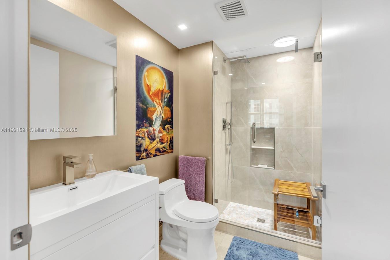 3131 Northeast 188th Street, Unit 2301 Aventura, FL 33180 - Photo 37 of 73 a bathroom with a sink toilet and shower