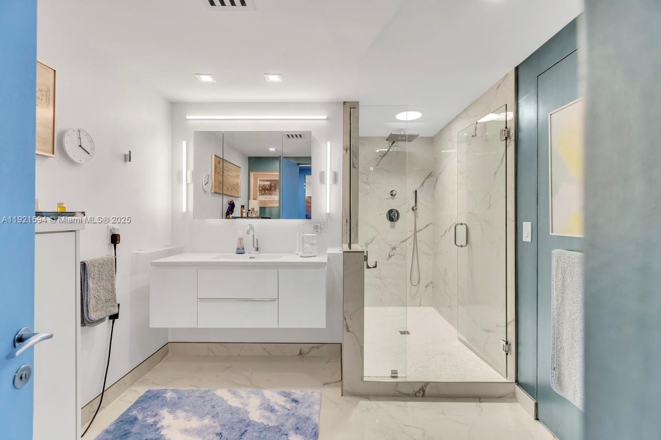 3131 Northeast 188th Street, Unit 2301 Aventura, FL 33180 - Photo 45 of 73 a bathroom with a sink mirror toilet shower and bathtub