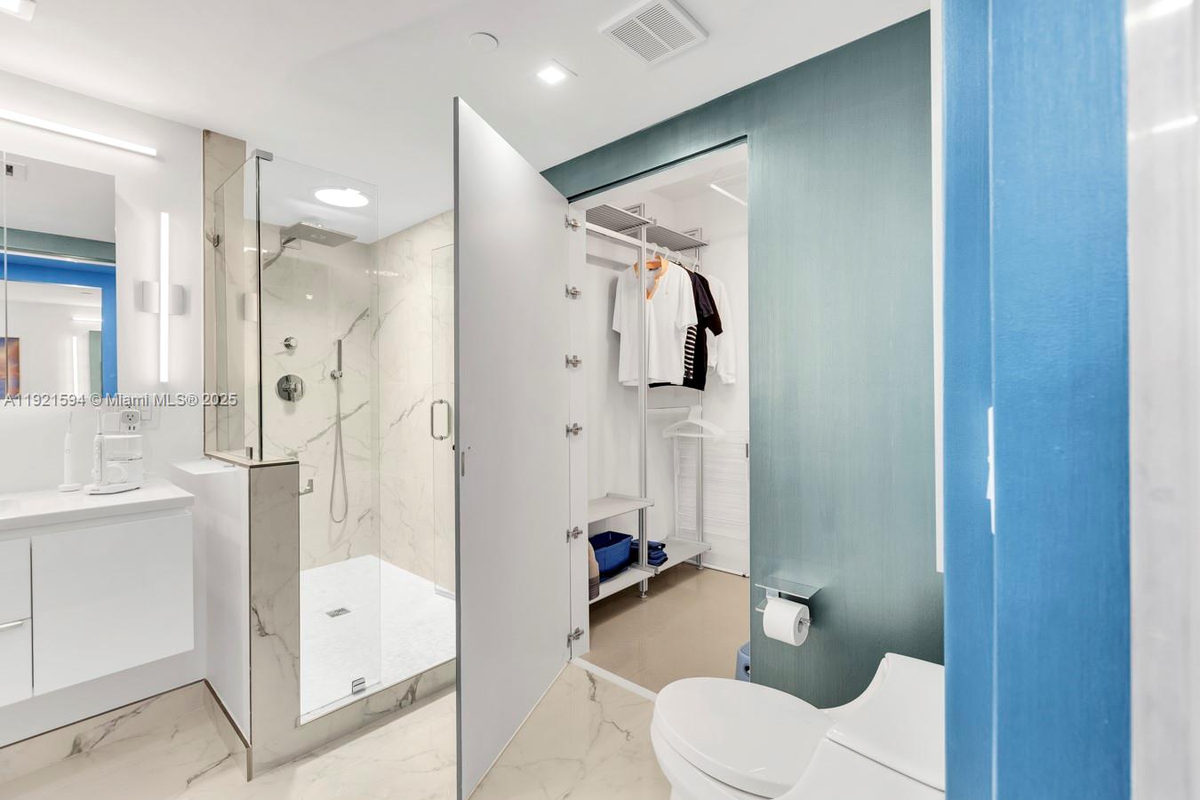 3131 Northeast 188th Street, Unit 2301 Aventura, FL 33180 - Photo 47 of 73 a bathroom with a shower toilet and sink