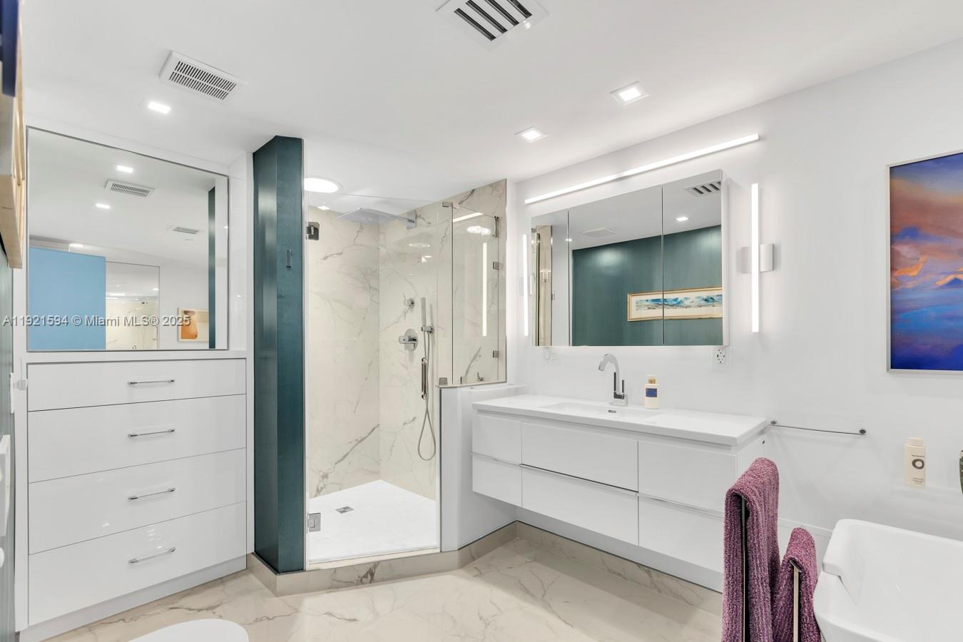 3131 Northeast 188th Street, Unit 2301 Aventura, FL 33180 - Photo 49 of 73 a bathroom with a double vanity sink mirror and bathtub