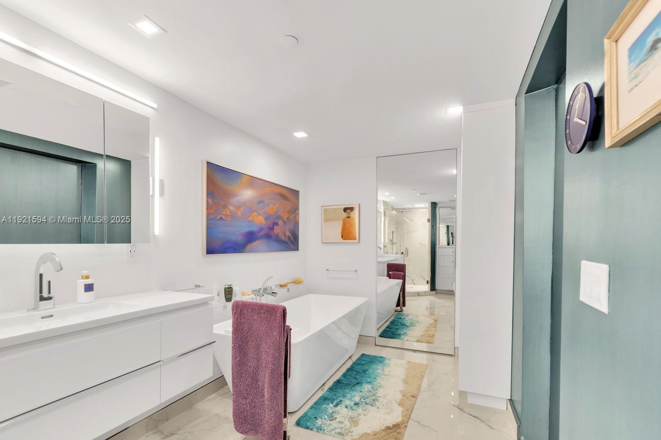 3131 Northeast 188th Street, Unit 2301 Aventura, FL 33180 - Photo 51 of 73 a bathroom with a bathtub and a double vanity sink