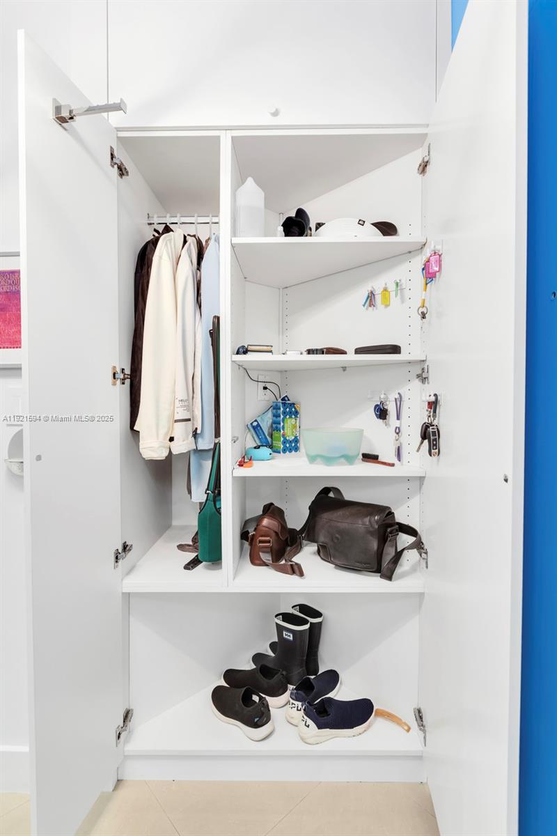 3131 Northeast 188th Street, Unit 2301 Aventura, FL 33180 - Photo 54 of 73 a bathroom with a sink and a mirror