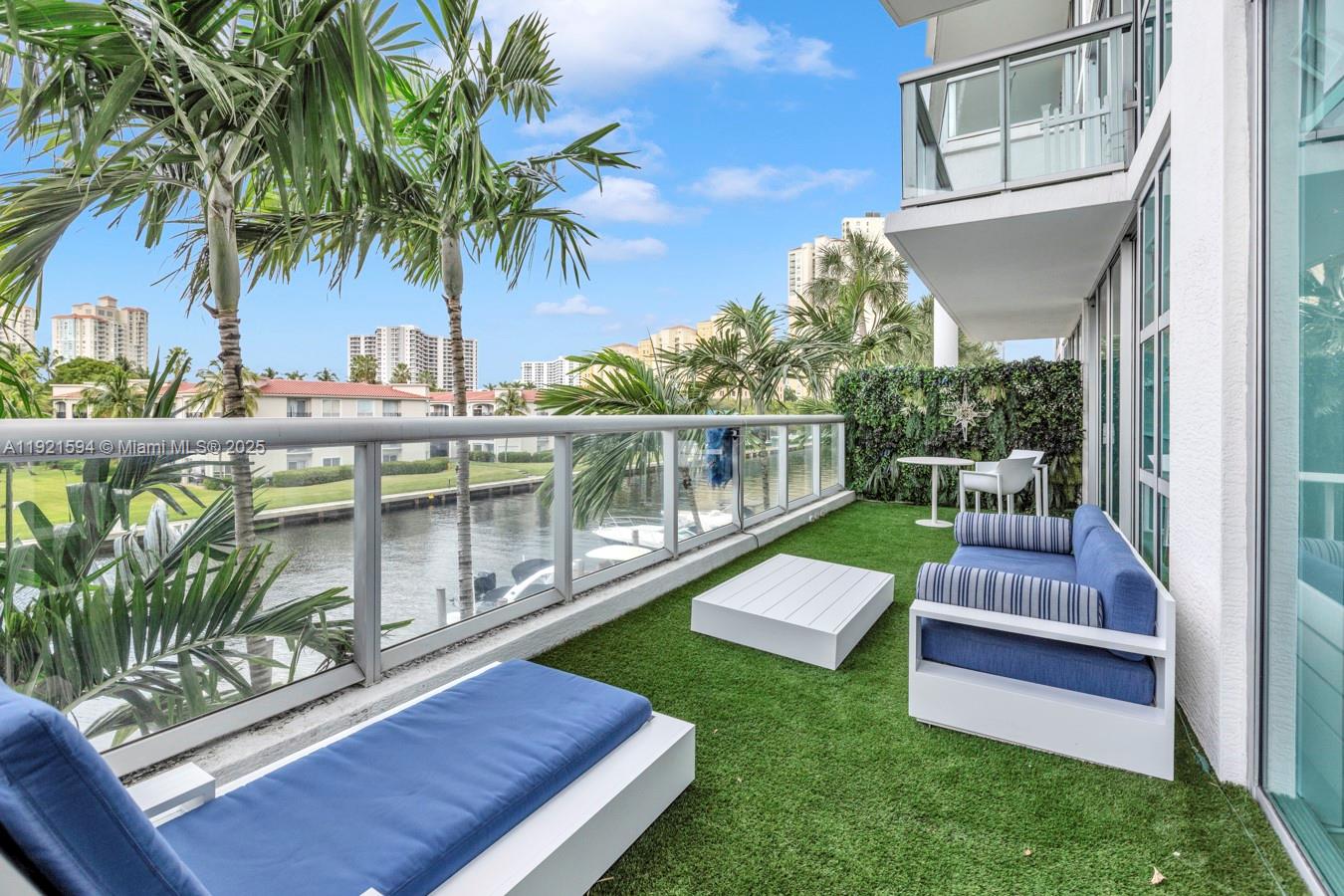 3131 Northeast 188th Street, Unit 2301 Aventura, FL 33180 - Photo 56 of 73 a view of a yard with furniture