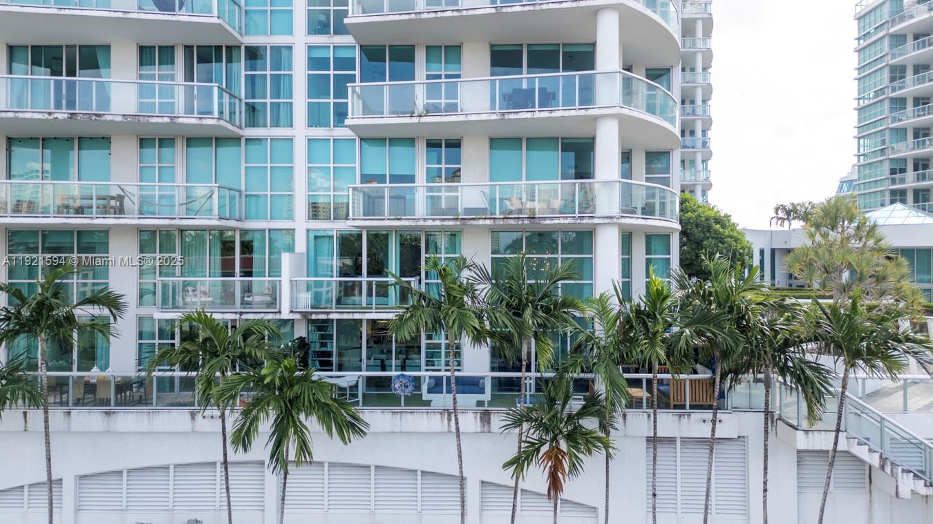 3131 Northeast 188th Street, Unit 2301 Aventura, FL 33180 - Photo 63 of 73 a view of a building with a garden
