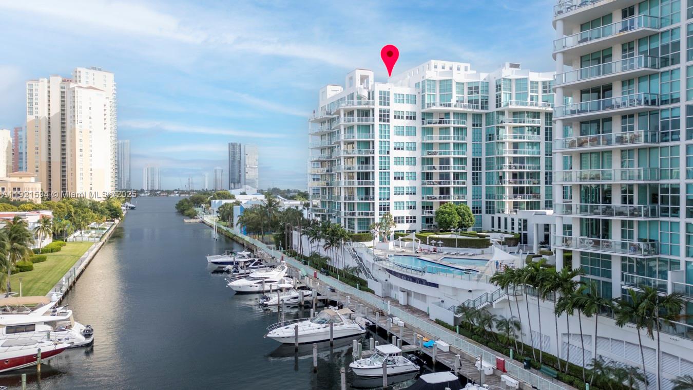 3131 Northeast 188th Street, Unit 2301 Aventura, FL 33180 - Photo 66 of 73 a picture of a table and chairs in patio