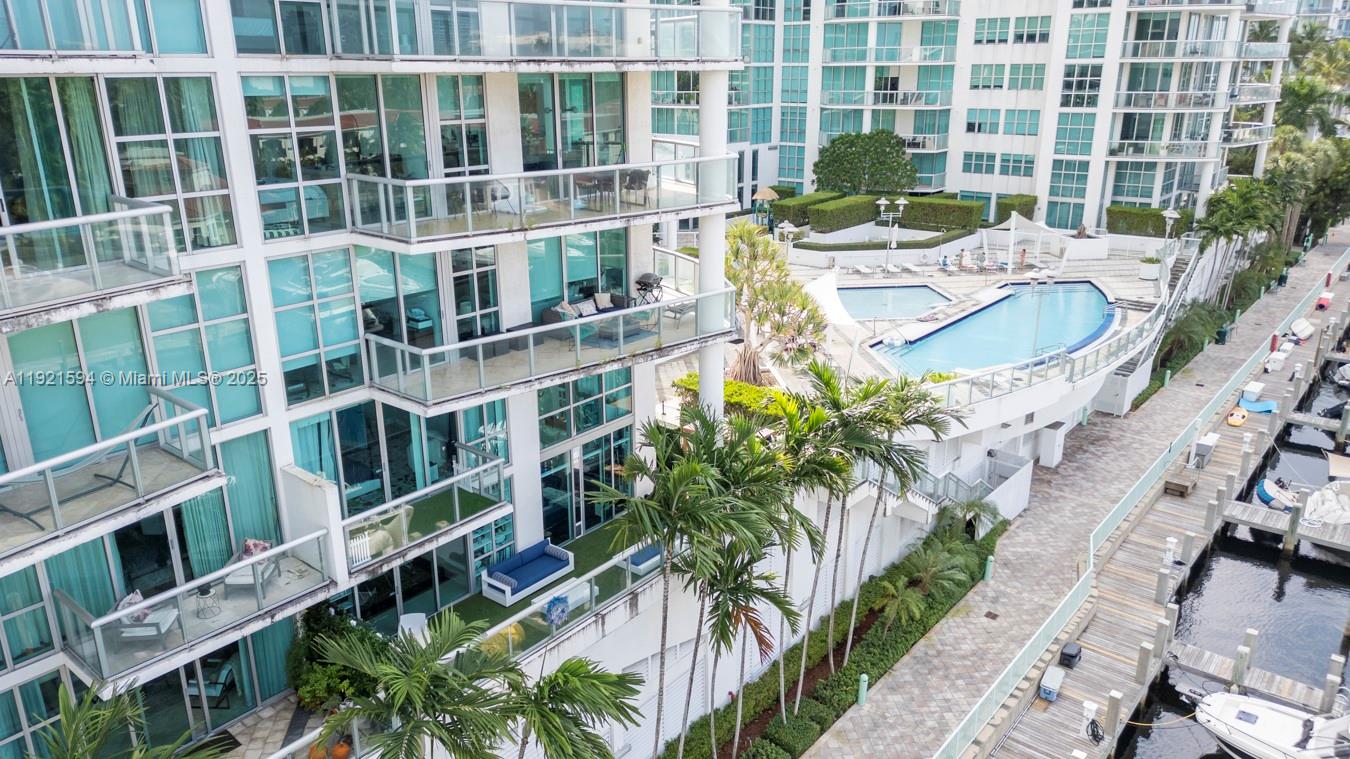 3131 Northeast 188th Street, Unit 2301 Aventura, FL 33180 - Photo 69 of 73 a front view of a house with a yard