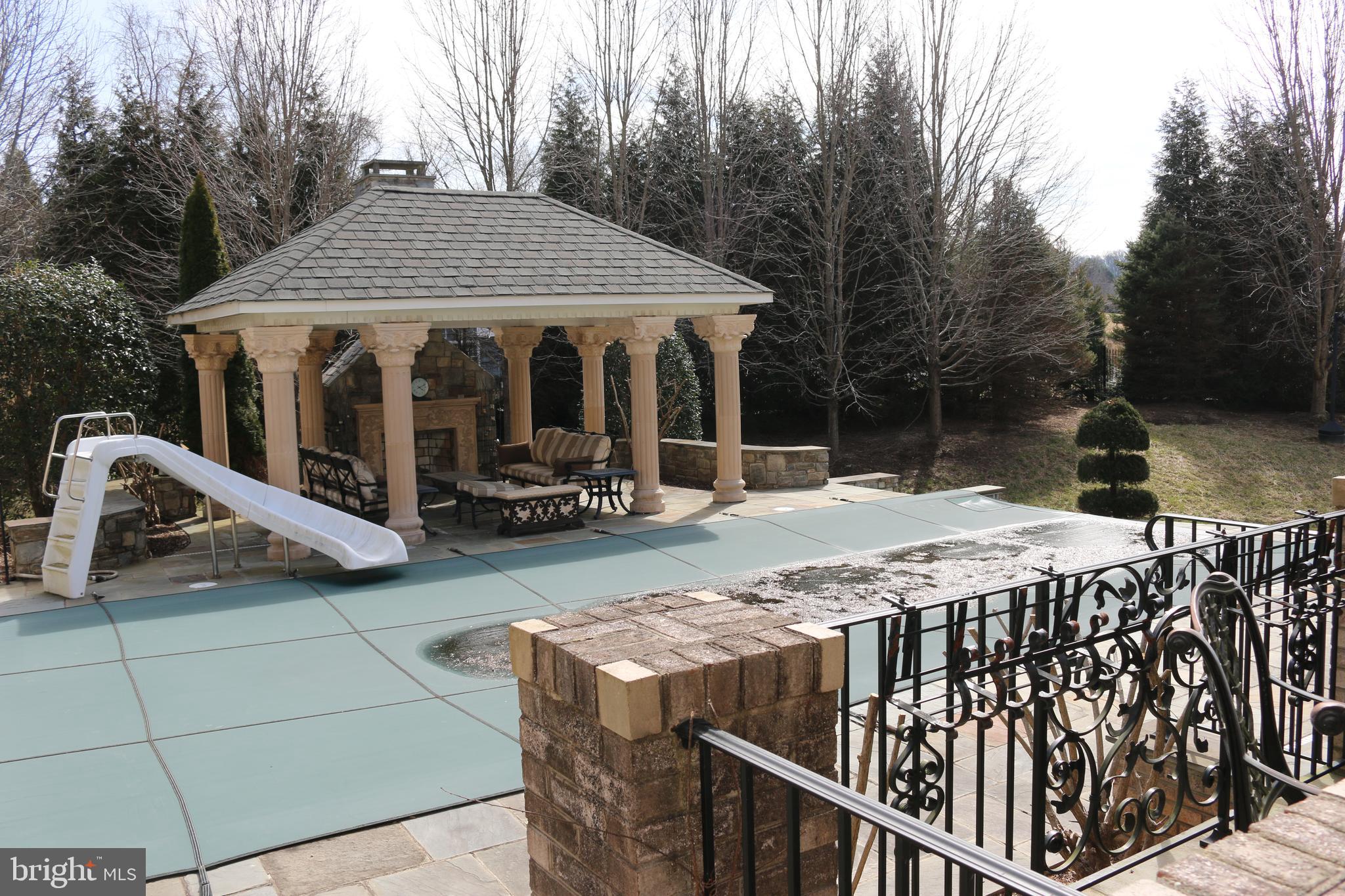 529 Springvale Road Great Falls, VA 22066 - Photo 28 of 90 Private backyard with pool, cabana with fireplace