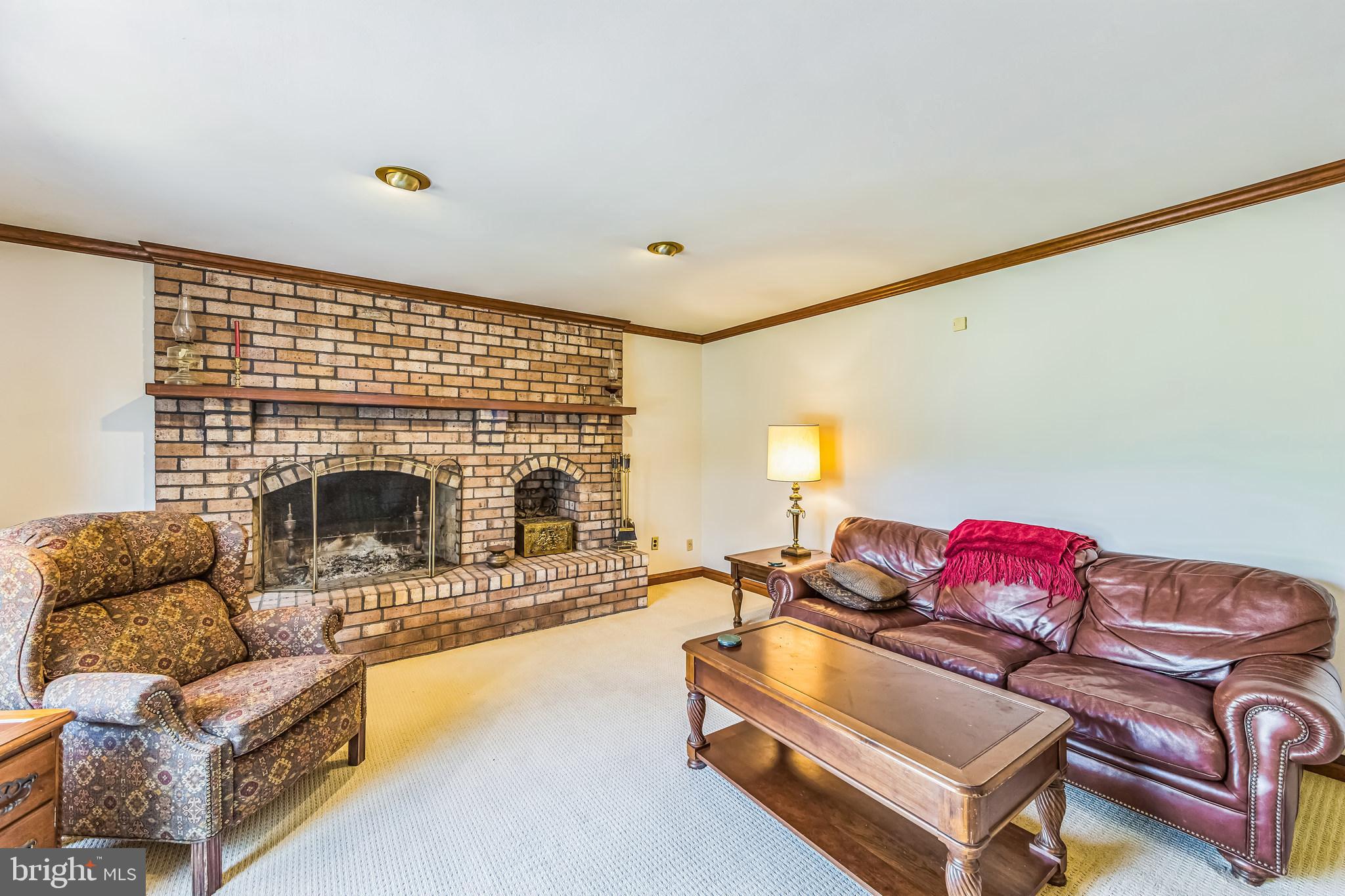 325 Tory Turn Wayne, PA 19087 - Photo 14 of 42 a living room with furniture fireplace and a flat screen tv