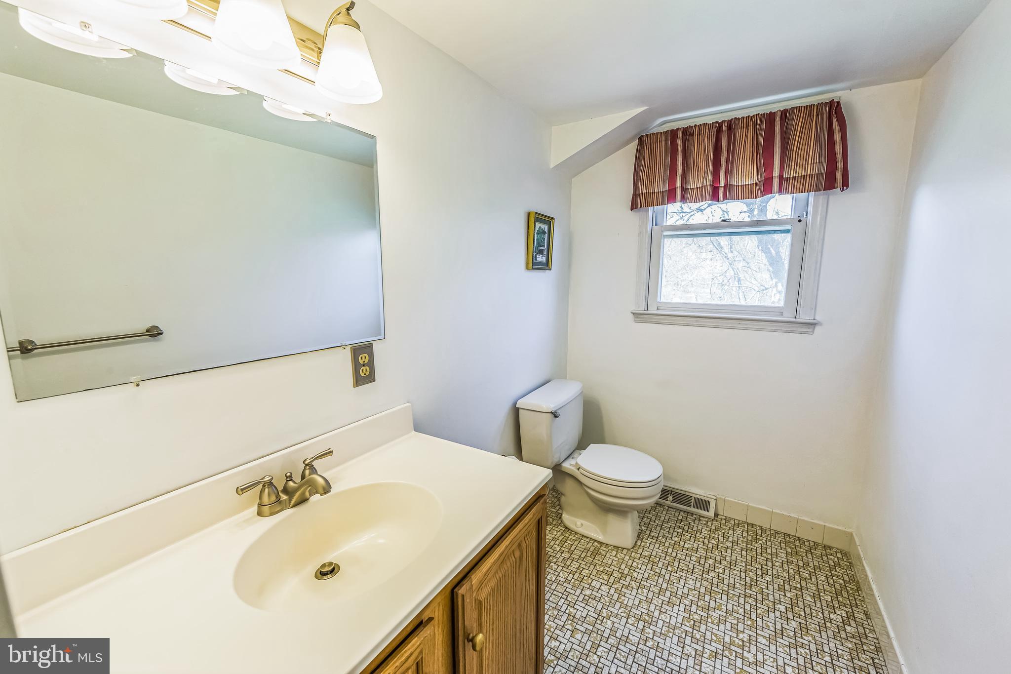 325 Tory Turn Wayne, PA 19087 - Photo 17 of 42 a bathroom with a sink a toilet and mirror