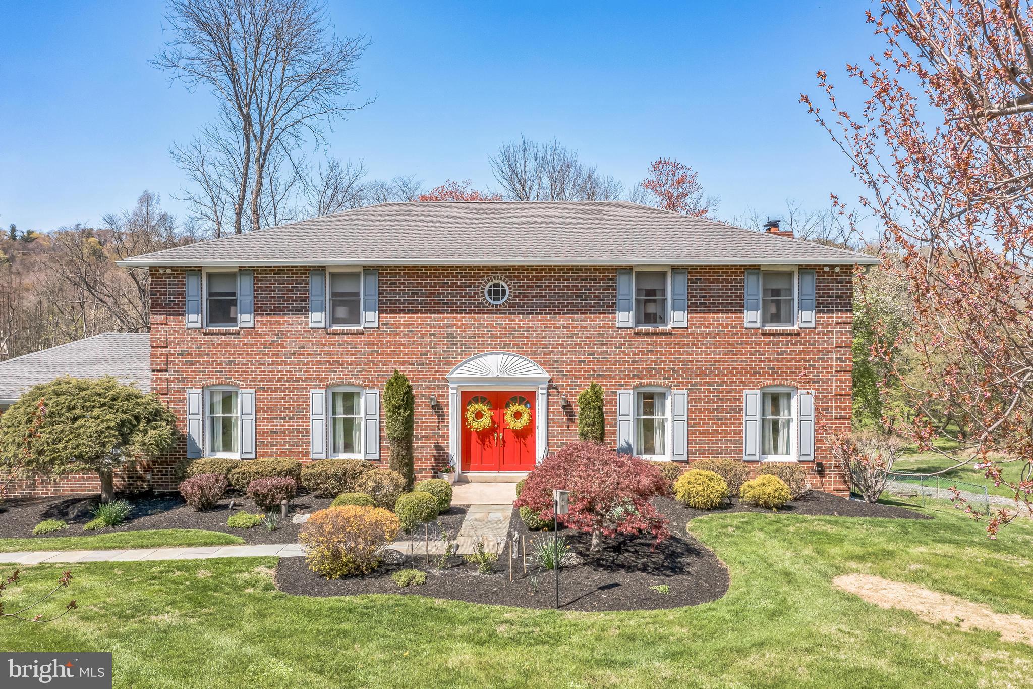 325 Tory Turn Wayne, PA 19087 - Photo 2 of 42 a front view of a house with yard and green space