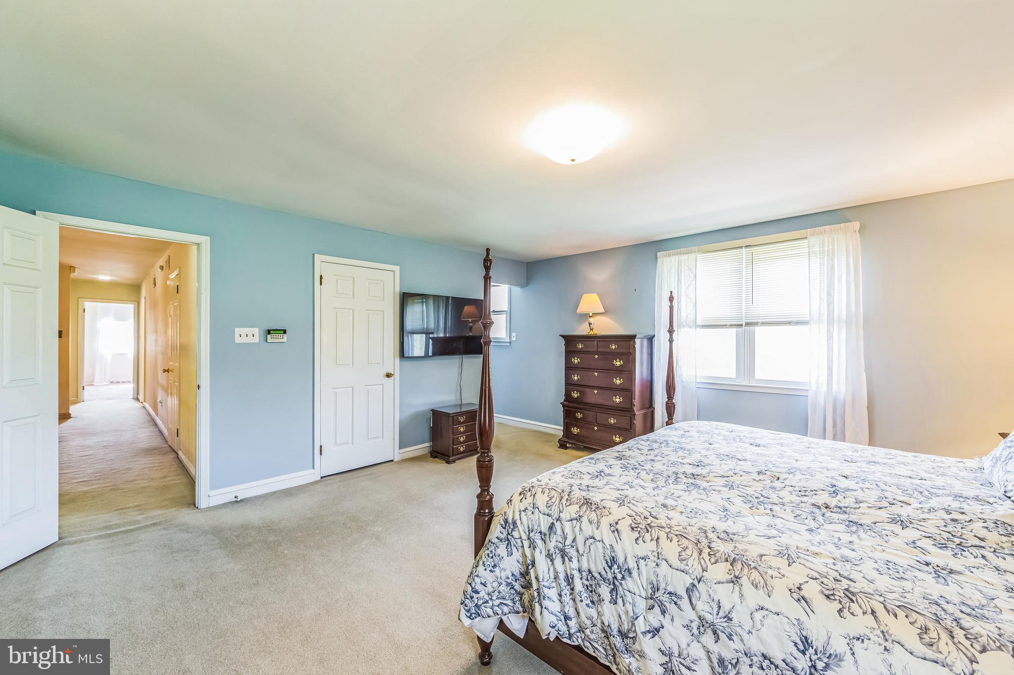 325 Tory Turn Wayne, PA 19087 - Photo 22 of 42 a bedroom with a large bed and a window