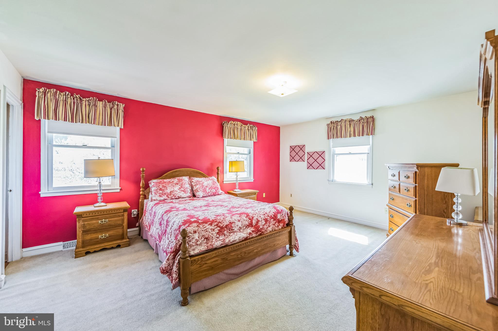 325 Tory Turn Wayne, PA 19087 - Photo 26 of 42 a bedroom with a bed and wooden floor