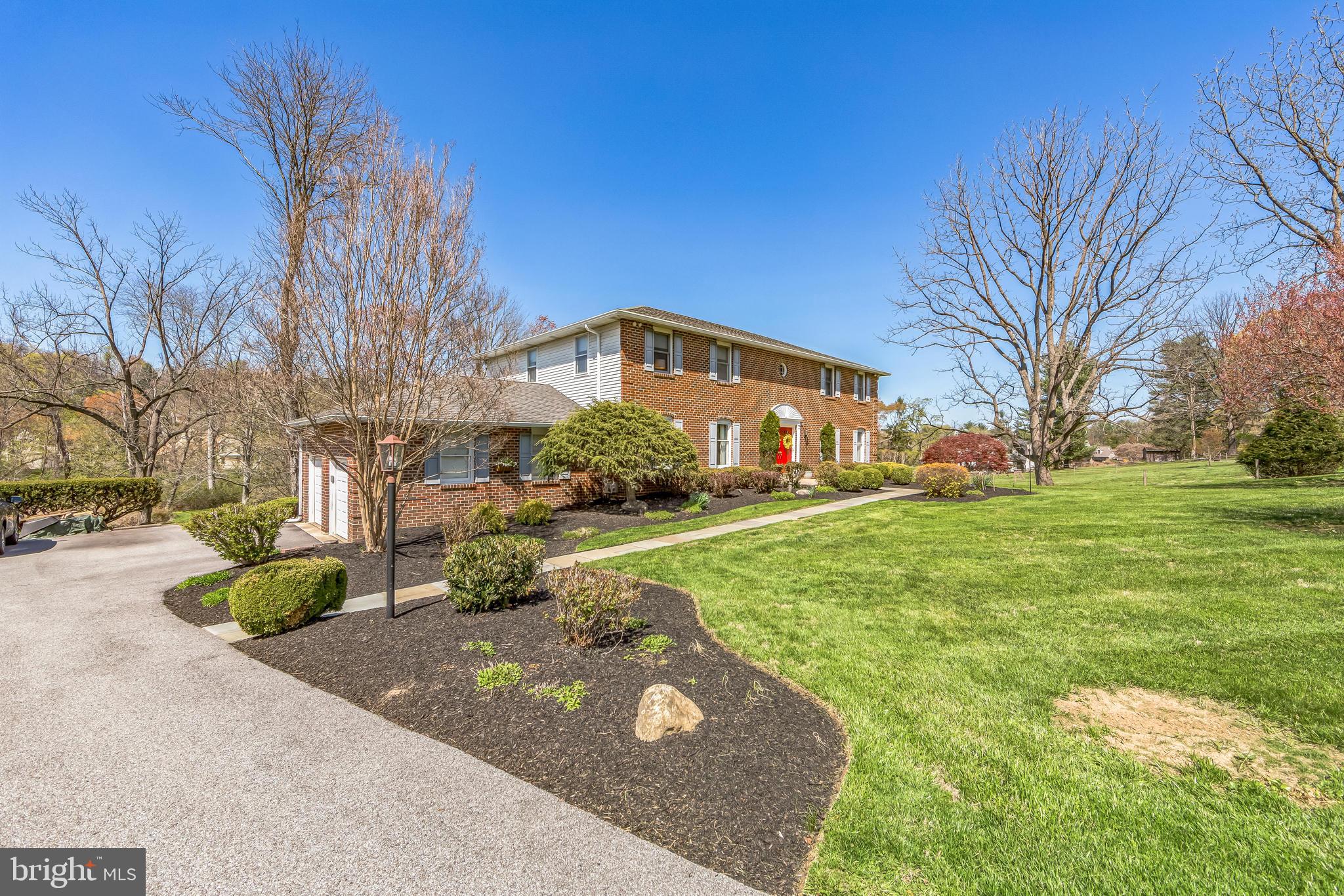 325 Tory Turn Wayne, PA 19087 - Photo 3 of 42 a front view of a house with garden
