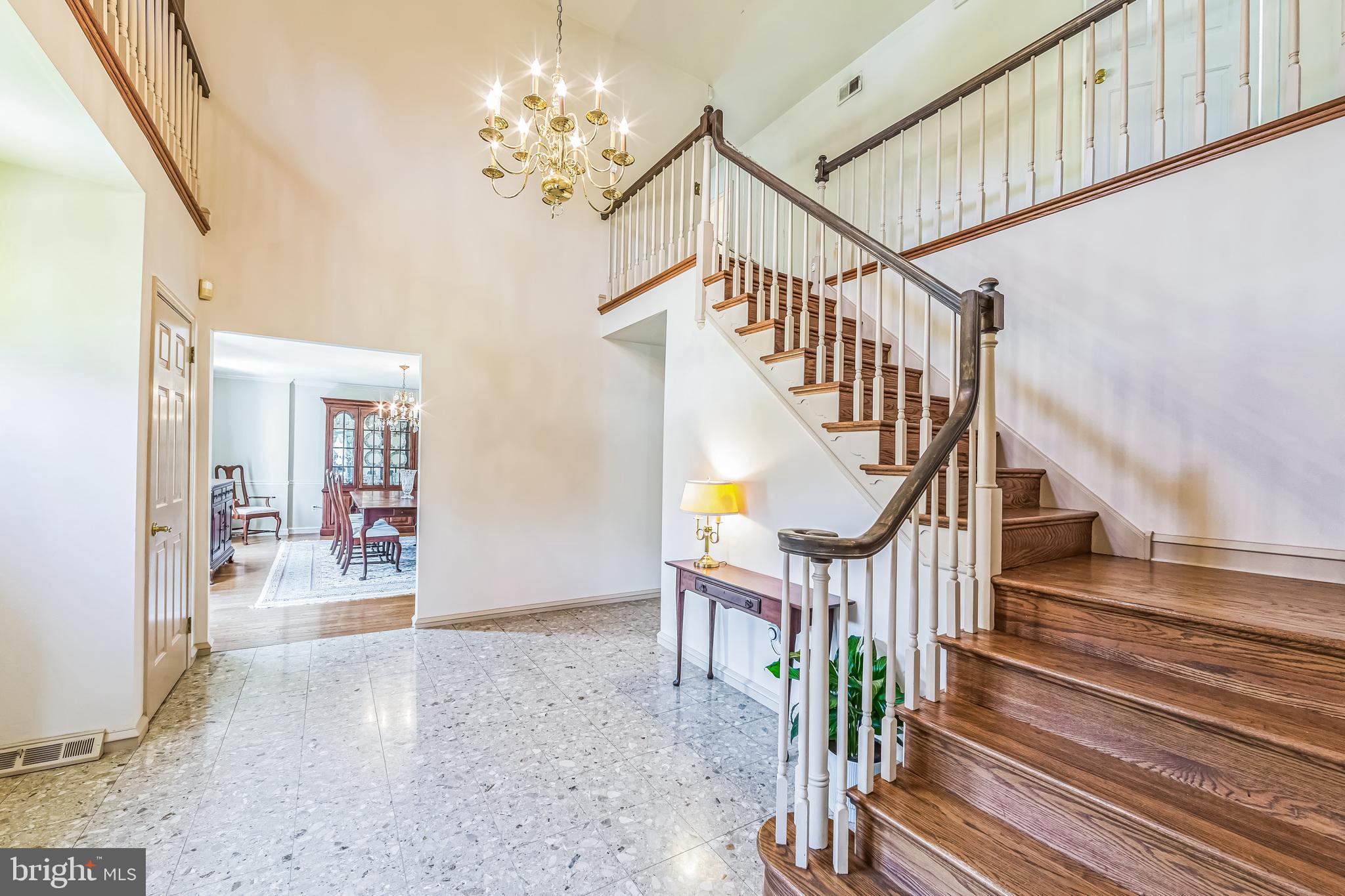 325 Tory Turn Wayne, PA 19087 - Photo 4 of 42 a view of staircase with lots of frames on wall and wooden floor