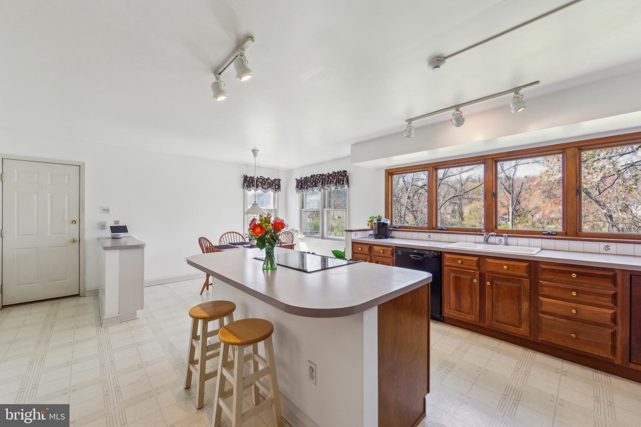 325 Tory Turn Wayne, PA 19087 - Photo 9 of 42 a kitchen with stainless steel appliances granite countertop a sink and a refrigerator