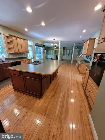 a room with wooden floors and lots of wooden furniture