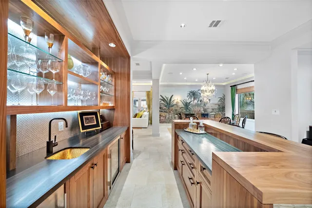 a kitchen with stainless steel appliances granite countertop a sink and stove