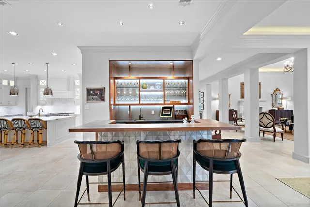 a large kitchen with a table and chairs