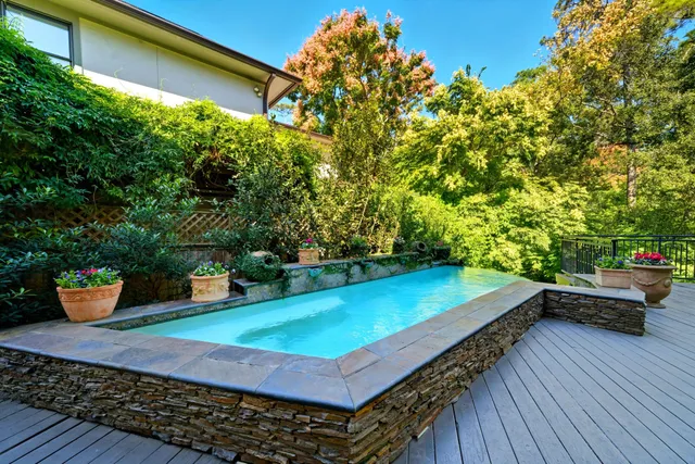 a view of a backyard with sitting area