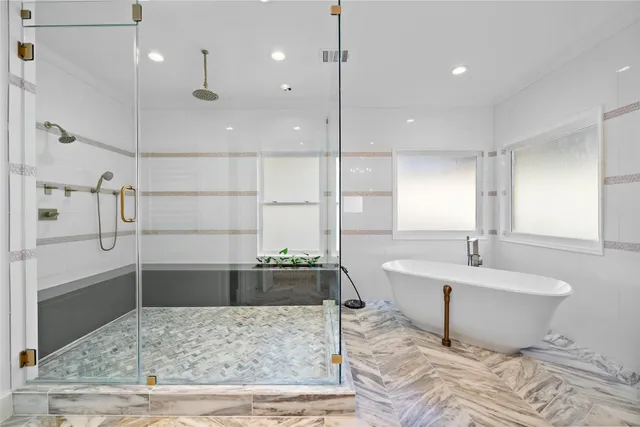 a bathroom with a bathtub and a sink