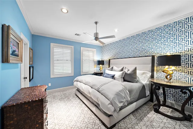 a bedroom with a bed window and a dresser