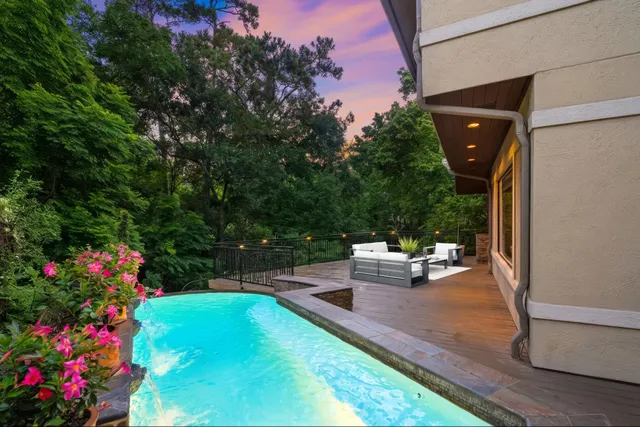 a view of a backyard with garden and flowers