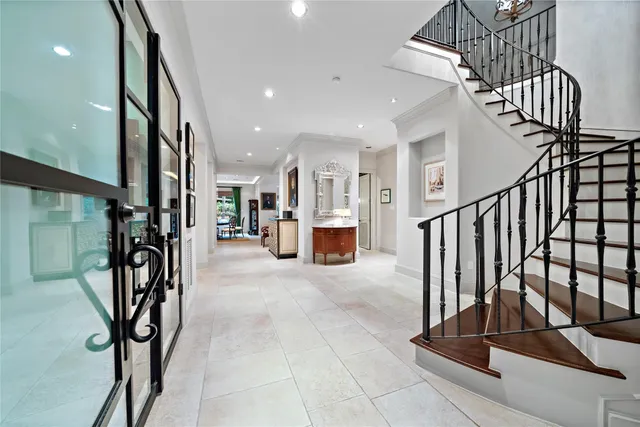 a view of a hallway with stairs