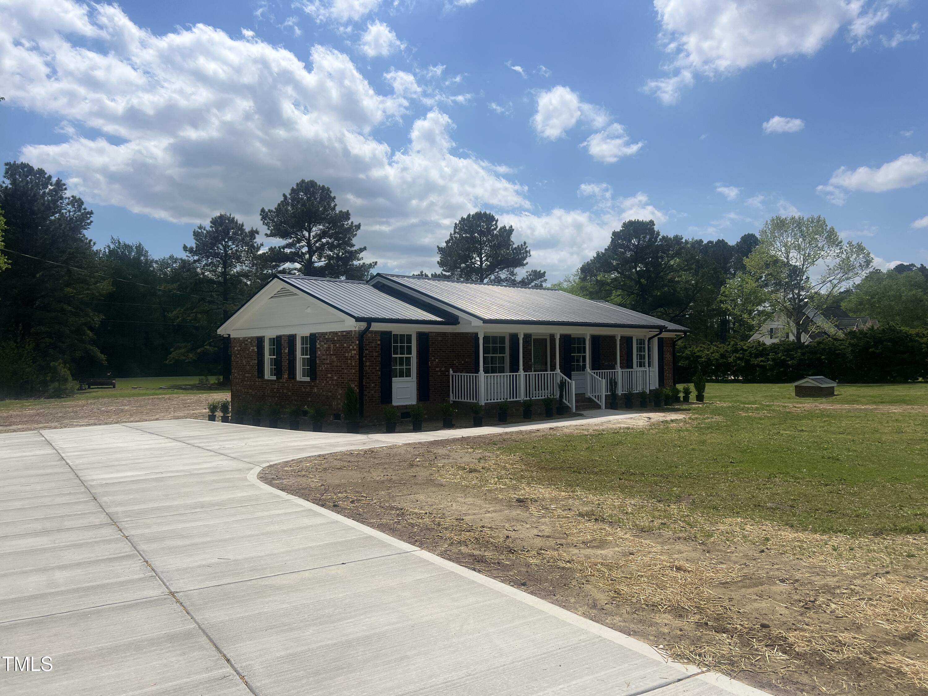 2130 Pearidge Road Angier, NC 27501 - Photo 8 of 48 a front view of a house with garden