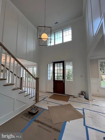 a large kitchen with kitchen island a sink stainless steel appliances and cabinets