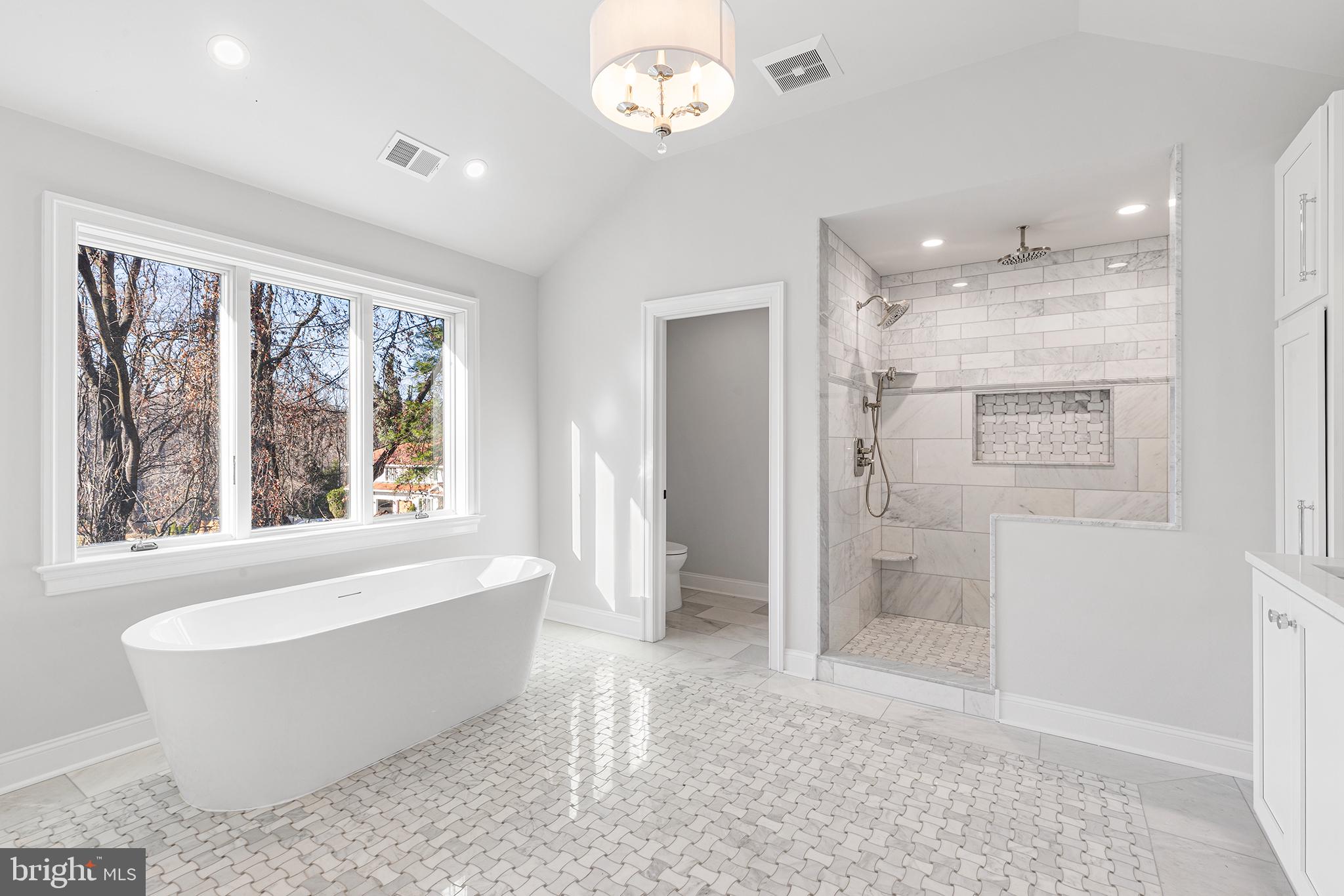 340 Hidden River Road Penn Valley, PA 19072 - Photo 38 of 57 a bathroom with a bathtub and a shower