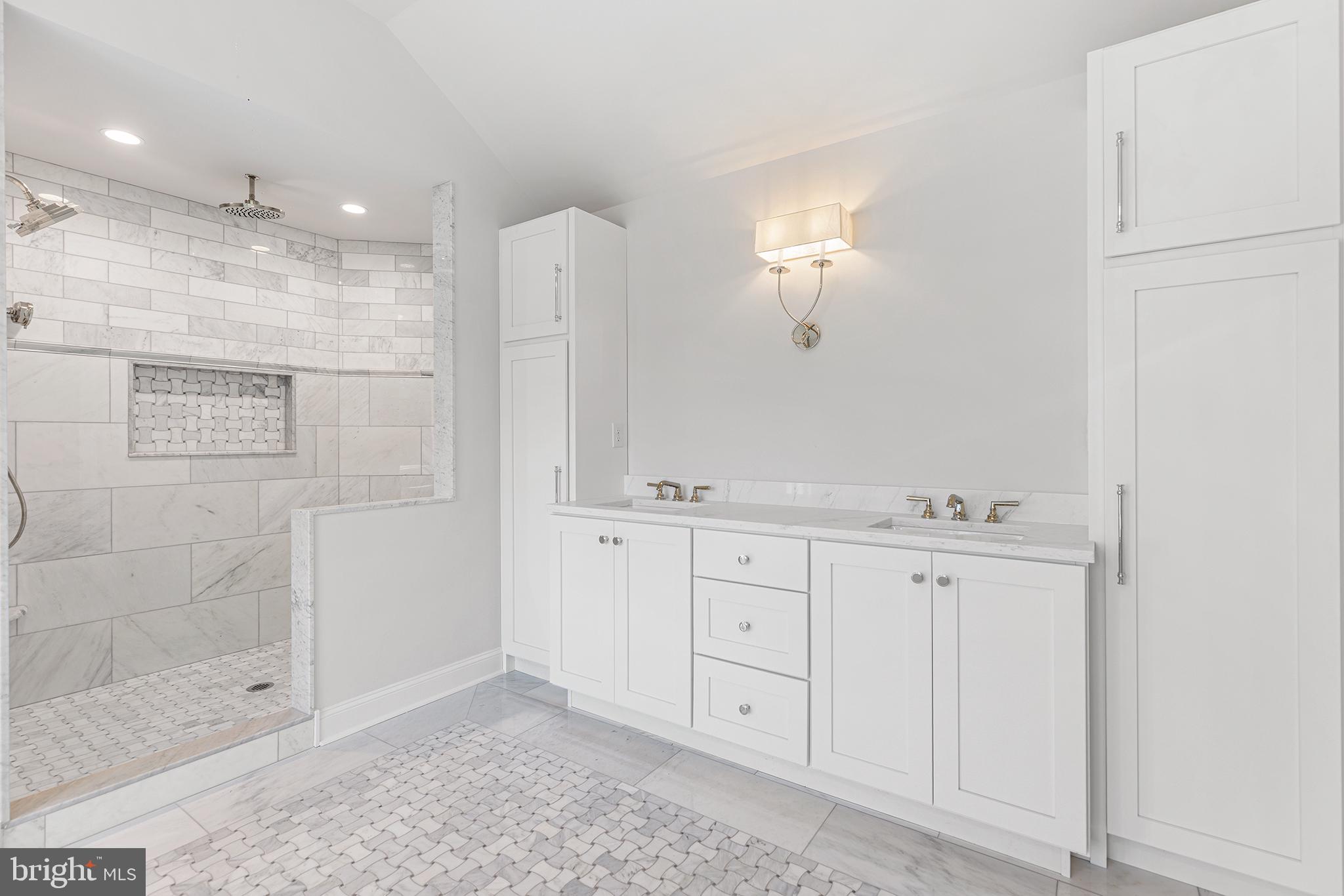 340 Hidden River Road Penn Valley, PA 19072 - Photo 39 of 57 a bathroom with a shower a sink and a mirror