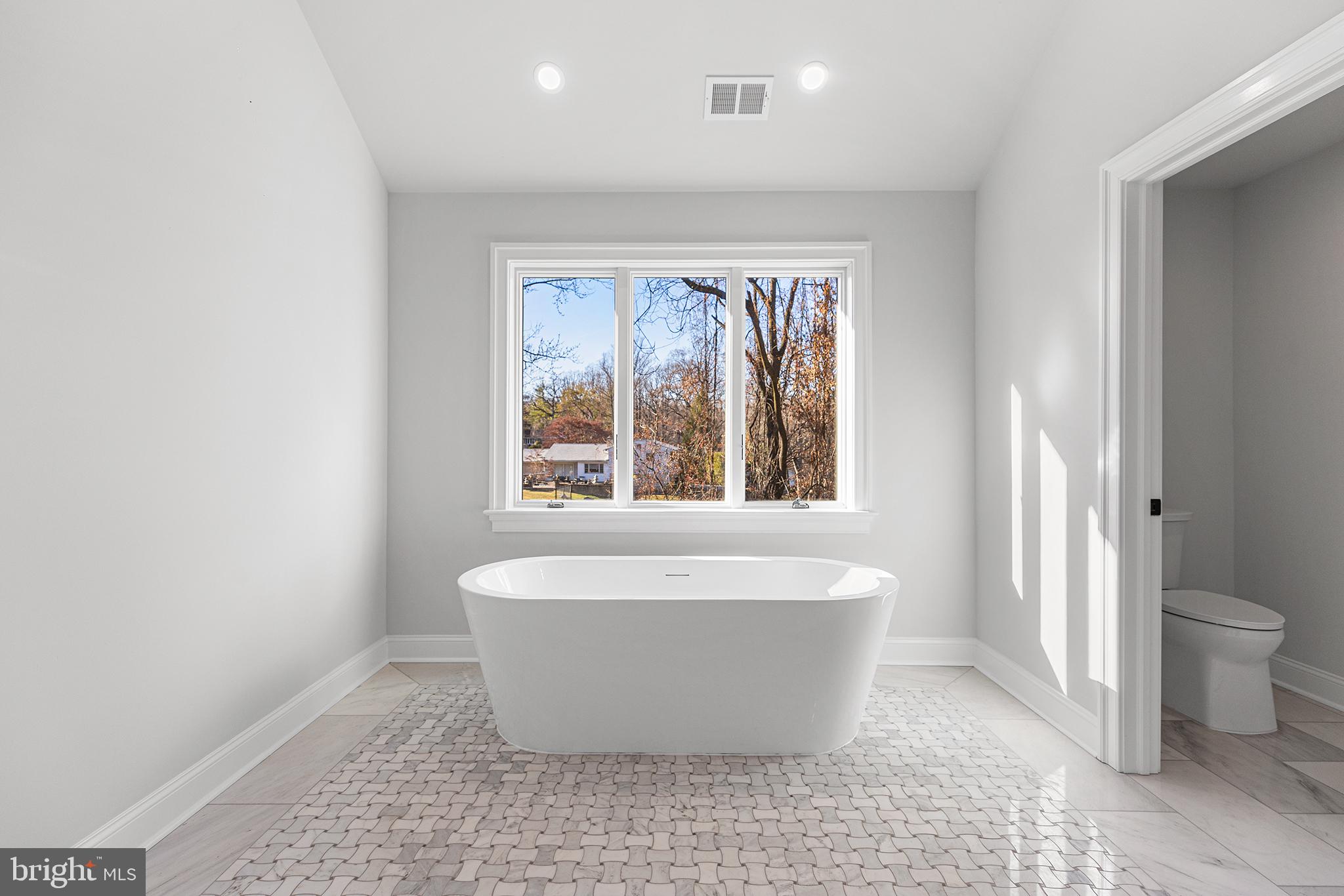 340 Hidden River Road Penn Valley, PA 19072 - Photo 40 of 57 a white bath tub sitting in a bathroom