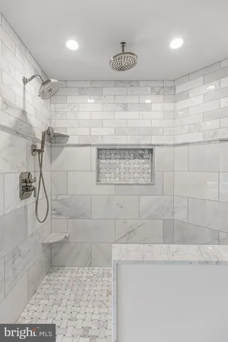 a bathroom with a toilet and a bathtub