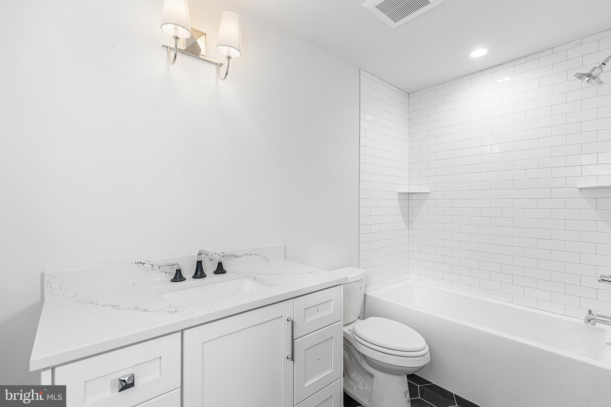 340 Hidden River Road Penn Valley, PA 19072 - Photo 43 of 57 a bathroom with a sink a toilet and shower