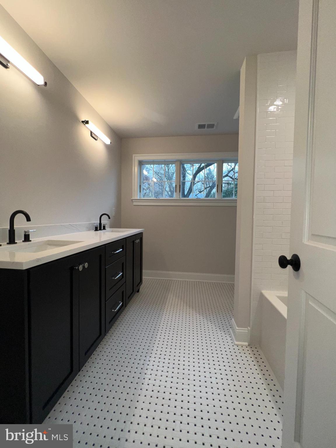 340 Hidden River Road Penn Valley, PA 19072 - Photo 47 of 57 a bathroom with a sink a toilet and mirror