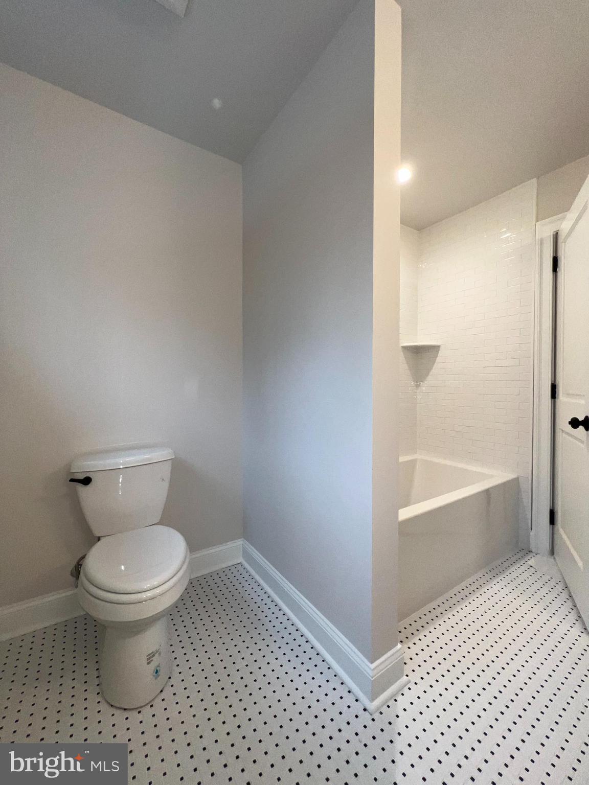 340 Hidden River Road Penn Valley, PA 19072 - Photo 48 of 57 a bathroom with a toilet and a bathtub