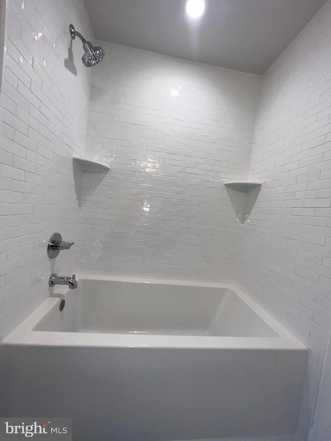 340 Hidden River Road Penn Valley, PA 19072 - Photo 49 of 57 a bathroom with a bathtub and a shower