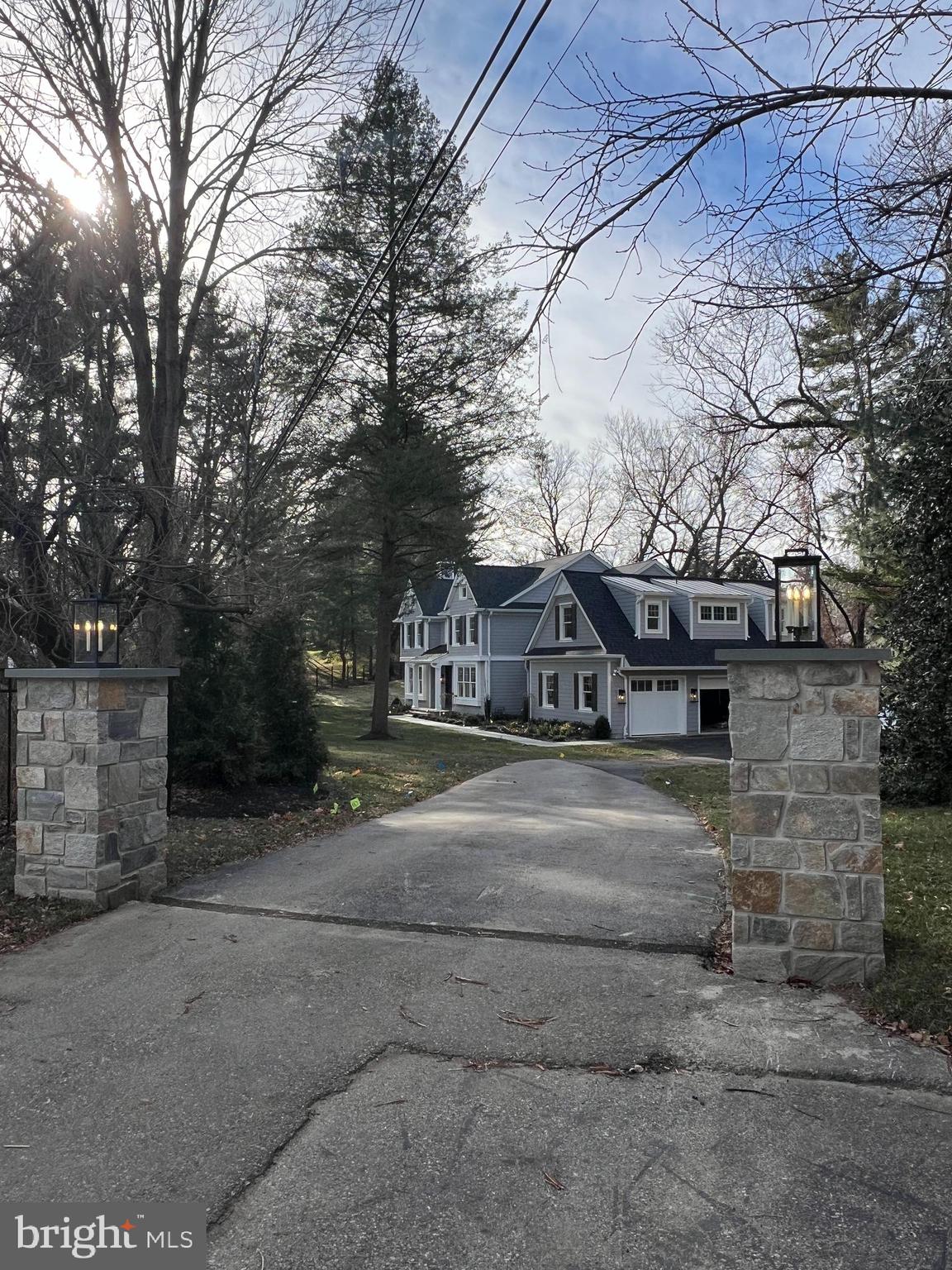 340 Hidden River Road Penn Valley, PA 19072 - Photo 55 of 57 a front view of a house with parking space and trees