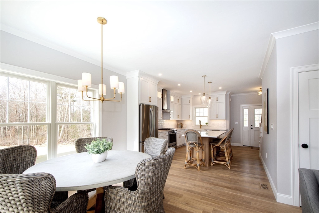 6 Grace Way, Unit 6 Scituate, MA 02066 - Photo 5 of 21 a view of a dining room with furniture window and wooden floor