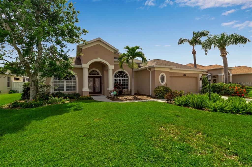 730 Old Quarry Road Bradenton, FL 34212 - Photo 2 of 65 a front view of a house with garden